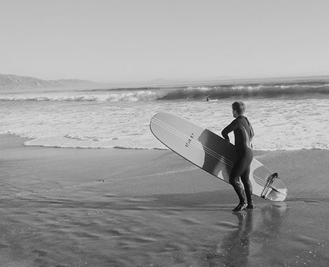 surfing surfer at the beach in california